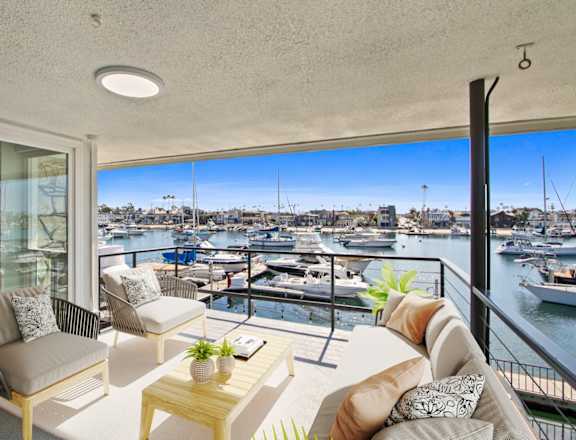 a living room with a view of a marina
