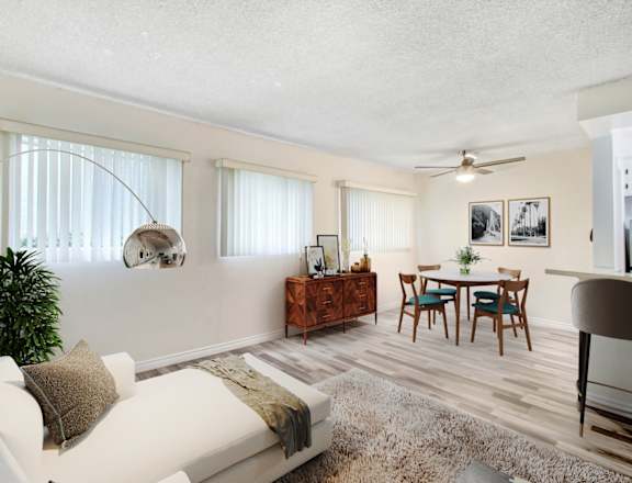a living room and dining room with a couch and a table
