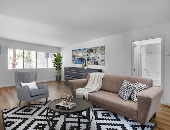 a living room with a couch and two chairs