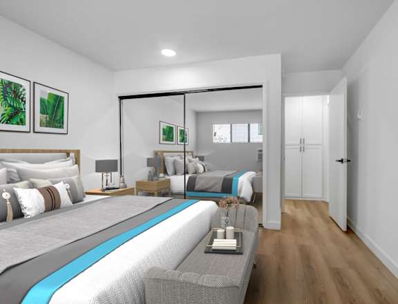 a bedroom with a large bed in a room