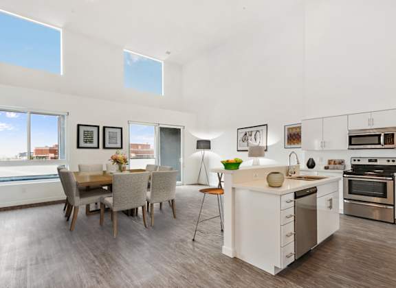 a kitchen and dining area in a 555 waverly unit