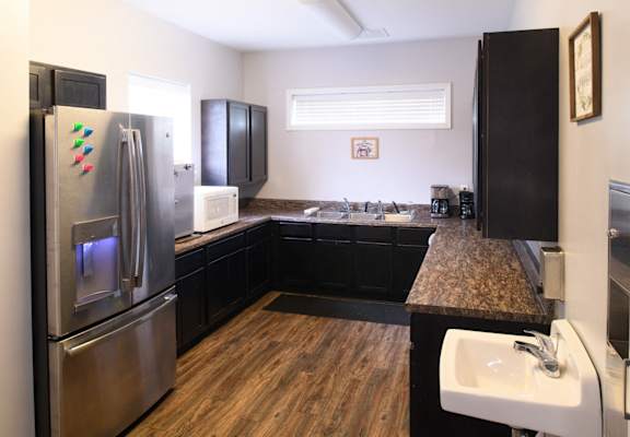 a kitchen with stainless steel appliances and granite counter tops