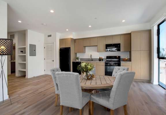a kitchen and dining area in a 555 waverly unit