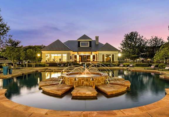 center front view of exterior pool and clubhouse at Palm Valley
