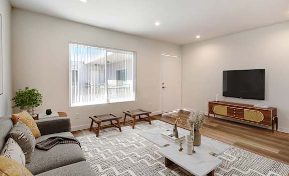 a living room with a couch and a tv