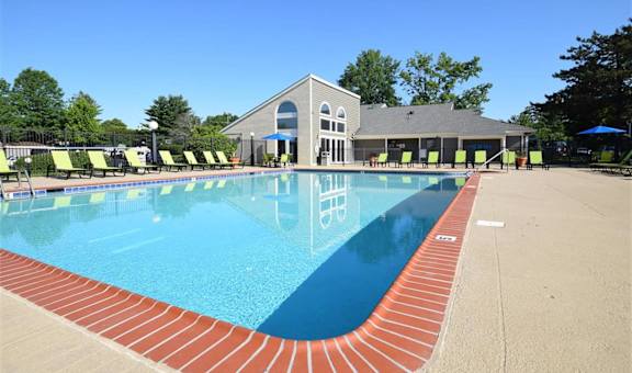 the swimming pool at the resort on a sunny day at Chinoe Creek Apartments in Lexington KY