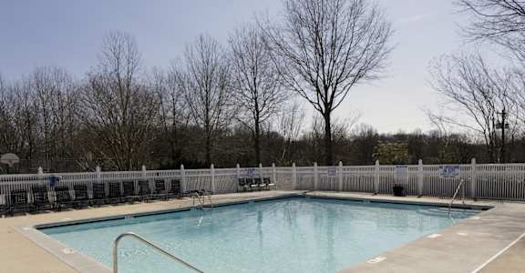 a swimming pool with a fence around it at Canaan Pointe