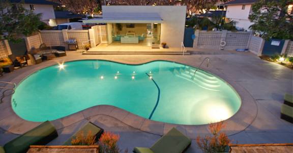 a house with a swimming pool in the backyard