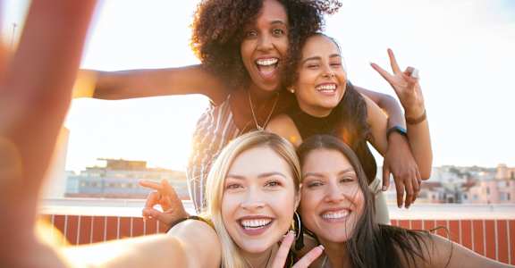 Four friends taking a selfie together. at Whisper Lake Apartments, Winter Park, 32792
