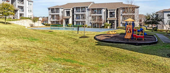 the preserve at ballantyne commons park with playground and buildings