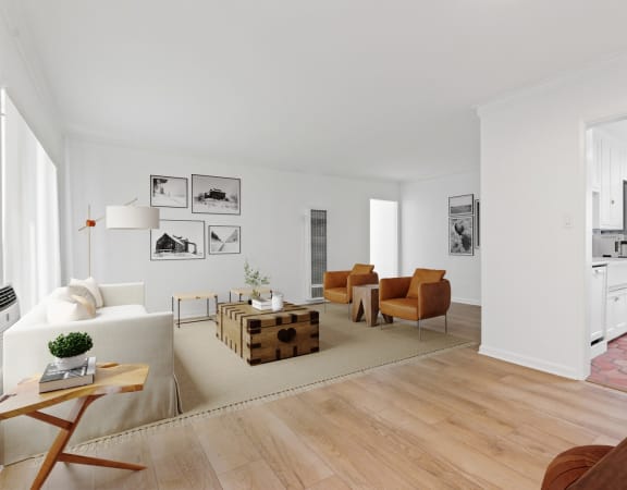 a living room with white walls and wooden floors