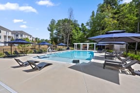 our apartments have a resort style pool with umbrellas