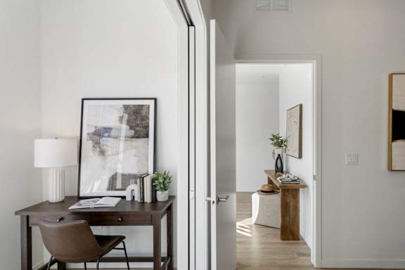 A room with a desk and a chair.