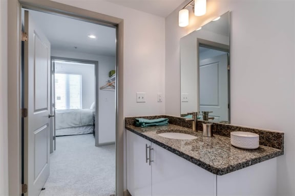 a bathroom with a sink and a mirror at East 51 At Rocketts Landing, Richmond, 23231