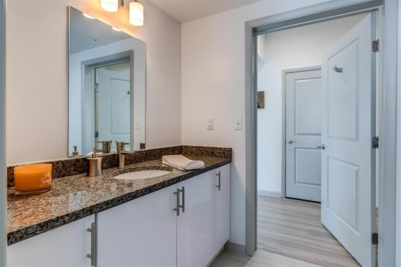 a bathroom at locale dallas victory park at East 51 At Rocketts Landing, Richmond, 23231