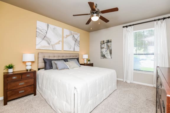 furnished bedroom with light yellow wall