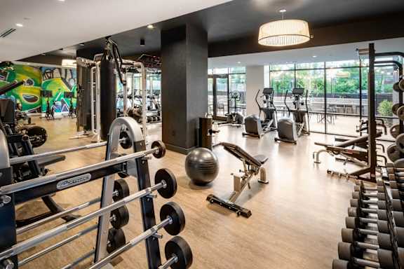 a gym with weights and other exercise equipment at The Irvine, Philadelphia