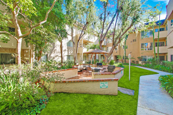 Resort-like picnic and barbecue area, lush landscaping