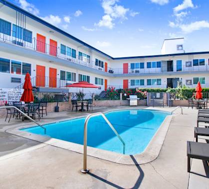 a swimming pool in the middle of an apartment building