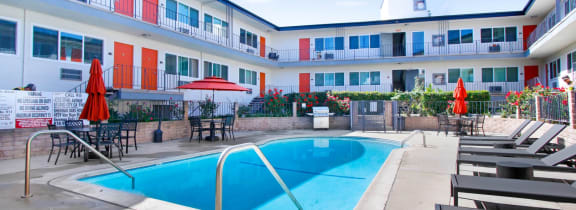 a swimming pool in the middle of an apartment building