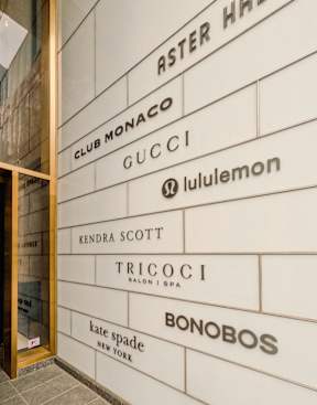 A wall with a list of brand names on it.