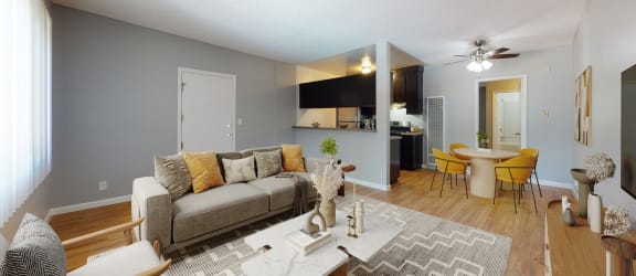 an open living room and dining room with a couch and a table