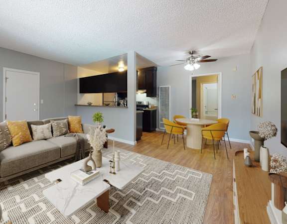 an open living room and dining room with a couch and a table