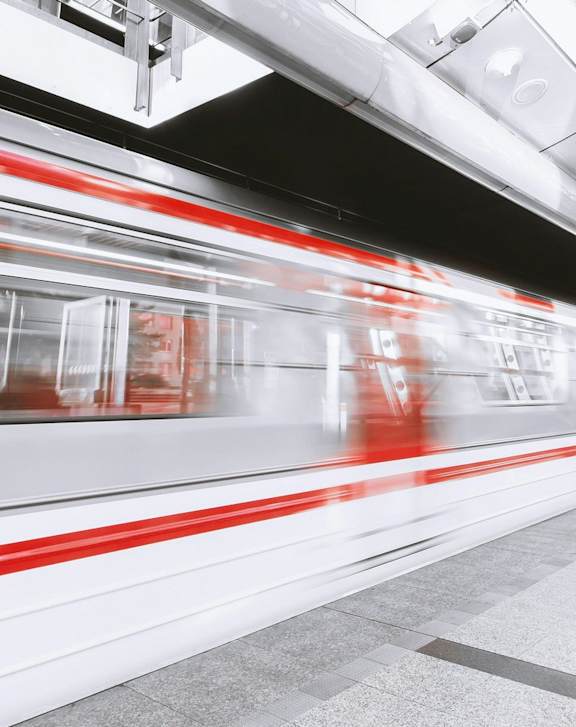 A train is passing through a subway station.