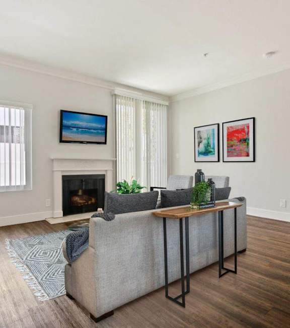 a living room with a spiral staircase and a couch and a table