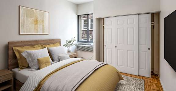 A bedroom with a bed, nightstand, and a painting on the wall.