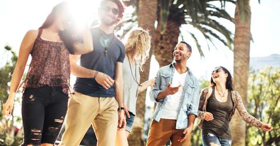 A group of friends are dancing together in a park. at Whisper Lake Apartments, Winter Park, 32792