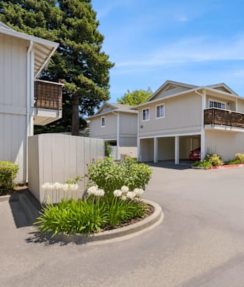 A sunny day at a residential complex with a clear blue sky.