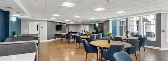 A large room with tables and chairs.