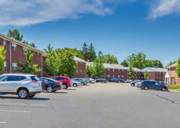 a parking lot in front of a brick building at Nottingham Manor Apartments, Montvale, New Jersey