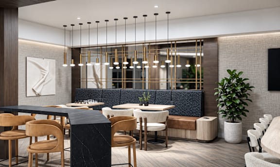 A modern dining area with a black table and chairs.