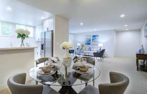 a kitchen and dining area in a 555 waverly unit