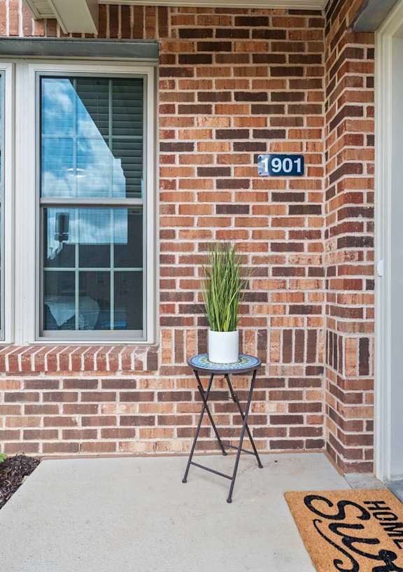 A blue door with a sign on the mat that says "HOMES FOR RENT".