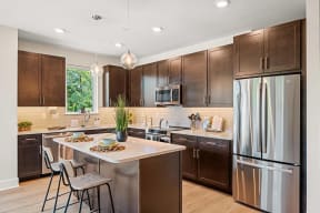 a kitchen with stainless steel appliances and wooden cabinets