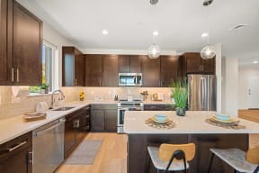 a kitchen with stainless steel appliances and wooden cabinets