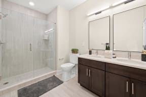 a bathroom with a shower toilet sink and mirror
