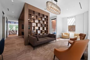 a living room with a couch and chairs