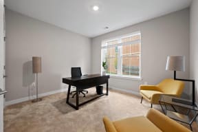 a living room with a piano and a large window