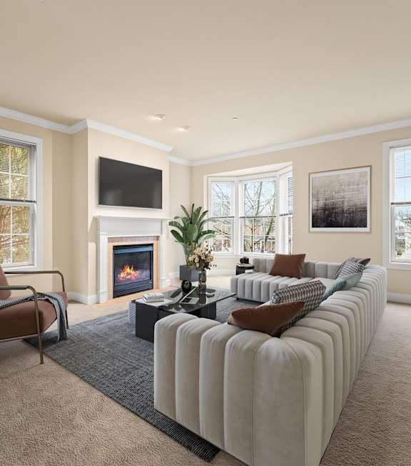 A living room with a fireplace and a couch.