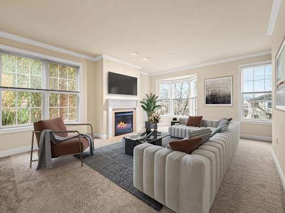A living room with a fireplace and a couch.