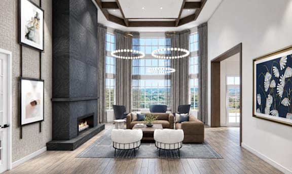A modern living room with a fireplace and a large window.