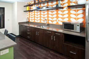 Kitchenette in Club Room of 2800 Girard Apartments