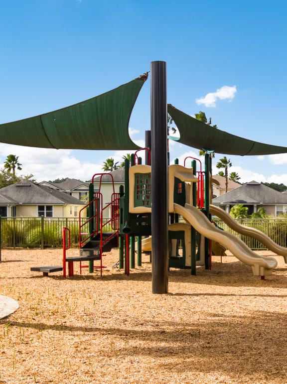 a playground with a swing set and monkey bars