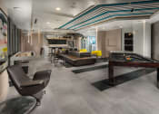 Thumbnail 11 of 27 - Club house game room with pool table and seating