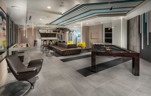 Club house game room with pool table and seating