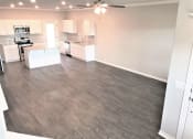 Thumbnail 28 of 60 - B3 (1-car) Living Dining open concept with laminate wood flooring